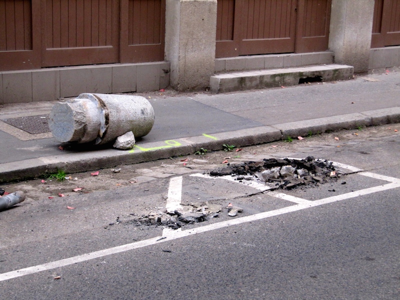 Bollard ripped out of the road